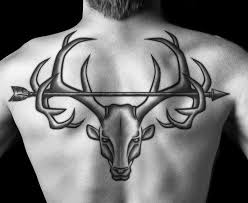 Man With Upper Back Arrow Across Deer Antlers Tattoo Jpg 550 450 Back Tattoo Deer Skull Tattoos Hunting Tattoos