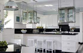 You can choose whichever design you want but if you want the cabinets to touch the ceiling would be the ideal height. Suspended Kitchen Cabinets Design Ideas