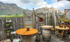 Fresh tuna lies on ice, fish merchant smokes hookah. Bay Harbour Market Hout Bay About Facebook