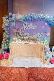 The sea backdrops and water effects on the top picture are just plastic tablecloths cut in strips (leaving a couple of inches at the top), and each strip stretched outward every couple of inches. Kara S Party Ideas Under The Sea Birthday Party Kara S Party Ideas