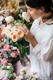 1800flowers.com has been visited by 100k+ users in the past month Download Premium Image Of Woman Smelling A Bouquet Of Romantic Vuvuzela Smelling Flowers Flower Photoshoot Flower Photos