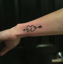 A tattoo depicting any body part being pierced by an. Heart And Arrow Tattoo Trendy Tattoos Tattoos Heart Tattoo Designs