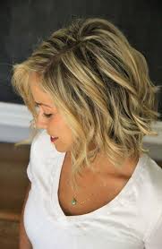 This lob is cut bluntly on the ends with some classic layers, looking soft and informal with soft beach waves and a marvelous blonde ombre color. 20 Feminine Short Haircuts For Wavy Hair Styles Weekly