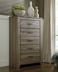 Embrace the country feel with this farm style bedroom , add style an unusual rough hewn headboard. Zelen Chest Of Drawers Ashley Furniture Homestore