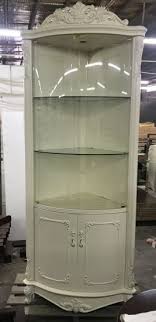 Choose a corner glass display cabinet with a shiny silver design to add some sparkle to your home. China Living Room Tall Triangle Corner Shelf Mdf Display Cabinet China Furniture Modern Furniture