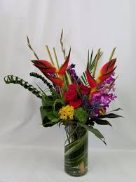 Carnations, daisies, irises, lilies, orchids, roses, sunflowers Tropical Paradise By Flowers With Flair
