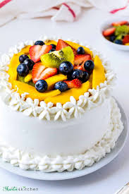 Spray a fine mist of canola spray onto a bench and put a piece of plastic wrap large enough to cover the cake on top, smoothing it out to remove all the creases. Vanilla Sponge Cake With Whipped Cream And Fruits Shweta In The Kitchen