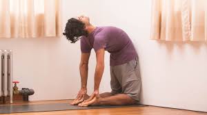 Kneel on the floor with knees hip distance and thighs perpendicular to this creates more space in the lower back. Use A Wall To Get More Out Of Standing Backbend Wheel And Camel