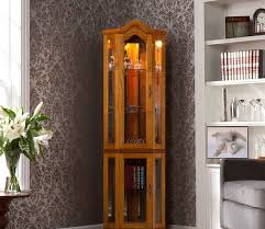 While most will have glass doors on the front to protect your treasures, there are styles that have make the most of a corner space with the biali lighted corner curio cabinet. Elegant Corner Curio Cabinet Ikea Homes Furniture Ideas
