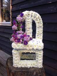 The smell of these flowers represents the deep sorrow. Vacant Chair Funeral Flower Tribute Flowers For Funerals Bespoke Funeral Flowers Www Thefloralart Funeral Flowers Funeral Floral Funeral Flower Arrangements