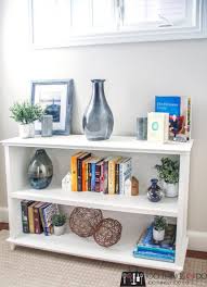 You can keep the books lying sideways one on top of another in case you think keeping them as shown in the picture might be damaging to the binding. How To Build A Diy Low Bookcase Bookshelf Storage Bookshelves Diy Bookcase Diy Low Bookcase
