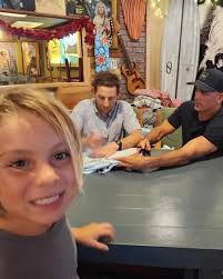 Thank you @kellyslater 🙏🤙 teamrider @dominick_n2014 dream came true!  #rawsurf #booksigning #thegoat #prosurfing #cocoabeach