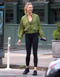 Orange is the new black: Karlie Kloss Proves To Be The Perfect Model For New Adidas Collab In An Olive Green Coat In New York Daily Mail Online