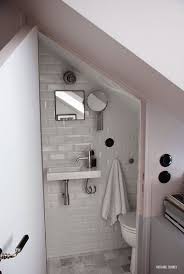 A Truly Tiny Apartment Under The Eaves In Paris Salle De Bains Sous Les Escaliers Petite Salle De Toilette Douche En Coin