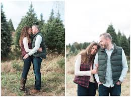 This engagement session is full of cuddles and cocoa as the couple play around a beautiful christmas tree farm snapping photos of each other all the way. Lori Kevin Perfect Christmas Tree Farm Engagement Session Jenniferlarsenphoto Com