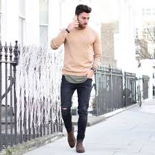 Black Jeans And Brown Boots Men Men S Beige Crew Neck Sweater Olive Tank Black Ripped Skinny Jeans Brown Suede Chelsea Boots Mens Outfits Mens Street Style Brown Suede Chelsea Boots