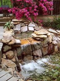 Schone Gartengestaltung Mit Bunten Blumen Und Einem Kleinen Teich Mit Steinen Wasserfall Garten Wasser Im Garten Garten