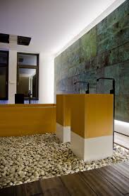 Industrial bathroom with geometric washbasin. The Bedroom Bathroom Combination Affair Continues