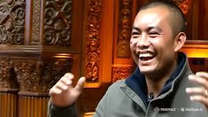 Joyful Man in Ornate Room with Warm Lighting