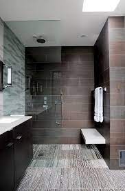 And if you need some way to brighten up a cramped space, one of the easiest modern bathroom decorating ideas is to simply arrange plenty of plants around the space. Dark Elegant Wall Tiles In Modern Bathroom Ideas Modern Bathroom House Bathroom Bathroom Design
