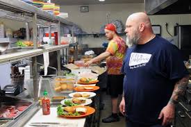 Chris Patterson Owner Of Oddfellows Burger Kitchen Prepares Burgers During The Restaurant S Final Week Be Burger Kitchen Burger Restaurant Restaurant Kitchen