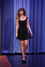 The words translate to, deeds not words. Dakota Johnson Flashes Long Legs And Rarely Seen Tattoo During Chat Show Appearance