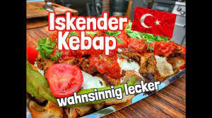 'i̇skender kebab' is the way of serving vertically roasted lamb meat slices, known as 'döner kebab', on a thin crust 'pide' bread. Iskender Kebap So Gut Habe Ich Selten Gegessen Westmunsterland Bbq Youtube