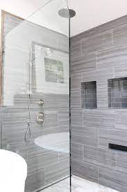 Diagonal tile patterns make a durable design statement and create the illusion of space. 12x24 Tiles All The Way To The Ceiling With Minimal Grout Lines Via Design Indulgence Before And Large Tile Bathroom Bathrooms Remodel Bathroom Shower Tile