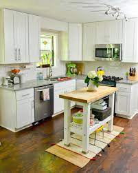 White Retro Kitchen With Small Wood Island And Vintage Accessories Kitchen Design Retro Kitchen Accessories Kitchen Island Design