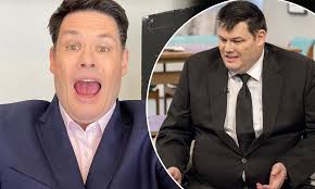 The Chase's Mark Labbett shows off slimmed-down frame in navy blue suit