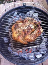 Using a tong, place the prepared chicken evenly on the grill. Whole Chicken On The Weber Jumbo Joe Cooking Whole Chicken Whole Roasted Chicken Bbq Whole Chicken