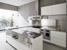 The bespoke kitchen features a huge slab of black granite work surface with a tactile brushed finish. Modern Modular Kitchen Designs Combine Comfort And Fabulous Aesthetics