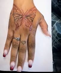 Black Butterfly hand tattoo red