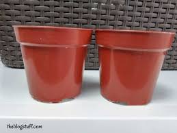 Create your own modern indoor plant pots using inexpensive pots and paint pens. How To Decorate Plastic Plant Pots