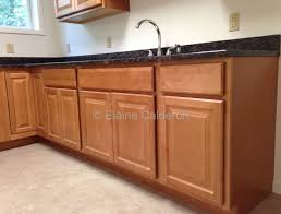Wolf Classic Cabinets Saginaw Maple Door Honey Finish Granite Countertop Tan Brown Classic Cabinets Countertops Granite Countertops