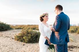 Beautiful hawaiian, ocean breezy silhouettes are the latest fashion for 2021. Winter Beach Wedding With Traditional Hawaiian Flower Crown Megan Callum