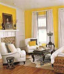 The settee in this room was given a modern update with wild fabric, while neutrals were used for the curved vintage sofa and rounded swivel chairs. Yellow Decor Decorating With Yellow