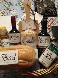 According to old european lore, traditional housewarming gifts should include bread, honey, salt, wine, sugar, coins, a broom, and a candle. Housewarming Bread Wine Olive Oil Honey Salt Candle House Warming Gifts Homemade Gifts For Mom Traditional Housewarming Gifts