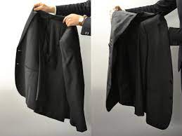 How To Pack A Suit 4 Simple Steps To Fold A Suit Properly Black Lapel Fold Suit Jacket Suit Jacket Suitcase Packing