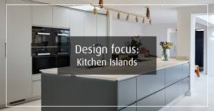While most kitchens goes for a warmer look, this kitchen uses cooler color tones for its palette. Design Focus Kitchen Islands Stoneham Kitchens