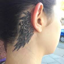 The wearer has a minimalist angel wing. Angel Wing Tattoo Back Best Designs That Will Inspire You