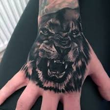 Top 51 Realistic Lion Tattoo Ideas 2020 Inspiration Guide Lion Hand Tattoo Lion Hand Tattoo Men Hand Tattoos