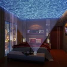Dive Into Bed Under The Projected Glow Of The Ocean Ocean Night Lights Ocean Bedroom Ocean Room
