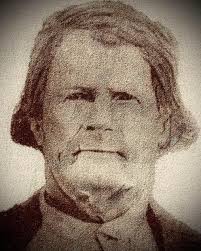 Joe D. Hatfield (1883–1963), son of Anderson "Devil Anse" and Levicy  Hatfield, holds up the tattered shirt that was worn by his Uncle Ellison  Hatfield