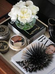 Inspired by fashion runways, this look embraces a classic black and white palette, bold colors, and posh prints. Styling Decorating Coffee Tables Coffee Table Vignettes Coffee Table Styling
