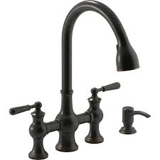 Old world, tuscan an oil rubbed bronze kitchen faucet integrates bronze with light and dark accents, resulting in an antique appearance. Kohler Capilano 2 Handle Bridge Farmhouse Pull Down Kitchen Faucet With Soap Dispenser And Sweep Spray In Oil Rubbed Bronze K R21070 Sd 2bz The Home Depot