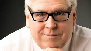 Of Character: John R. Koons enjoys sharing knowledge of financial literacy  with students through his job