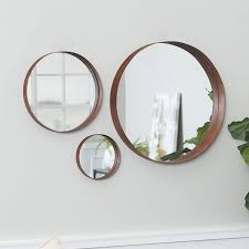 Hand crafted from rattan this mirror with its nautical theme makes for the perfect wall decoration whether you live close or far from the coast. Amazon Com Walker Edison Copper Round Wall Mirror Set Set Of 3 Home Kitchen