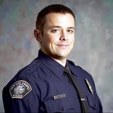 Flags at half staff outside San Luis Obispo Police Dept. in honor of fallen  detective