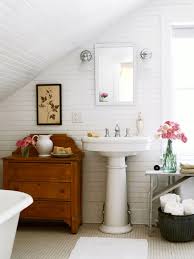 How to install a closet rod on an angled wall and add storage when working with a slanted ceiling closet, attic rooms. Under The Eaves Baths Better Homes Gardens